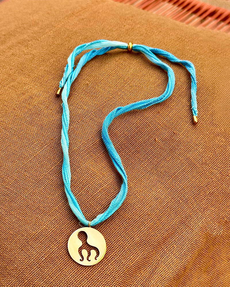 Collier poulpe 3 pattes - cordon de soie turquoise
